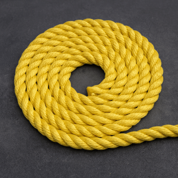 Coiled yellow 8-strand polyester sinking mooring rope used for marina and boat docking.