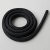 Coiled black PA Moor double braid polyamide rope on a neutral background.